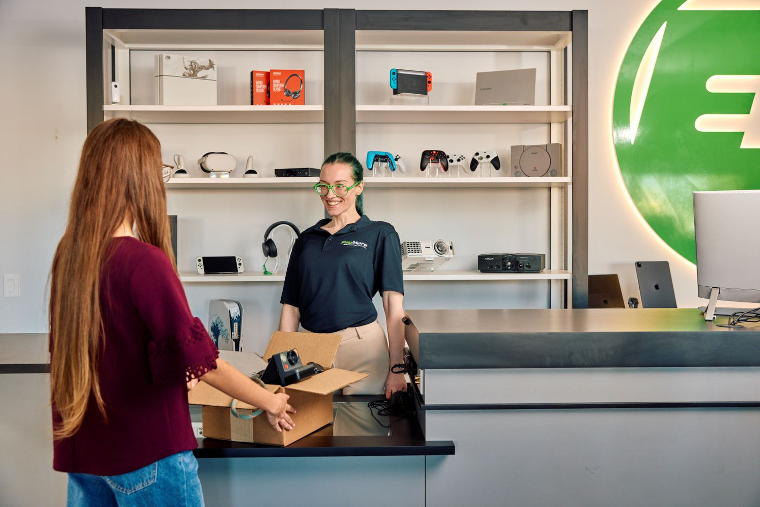 paymore employee inspecting electronics